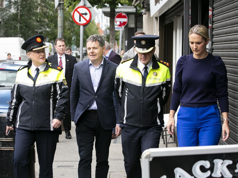 Assistant Garda Commissioner Angie Willis, Minister for Public Expenditure Paschal Donohoe, Chief Superintendent Pat McMenamin and Minister for Justice Helen McEntee walk past the spot where an American tourist was attacked on Store Street in Dublin. Photo: Collins